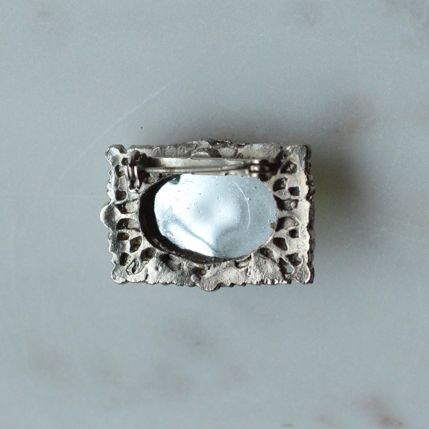 Vintage West Germany Style Brooch | 1.5" Faceted Peridot Green Glass | Ornate Silver Tone Filigree | Mid-Century Victorian Revival