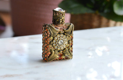 Vintage Jeweled Brass Filigree Perfume Bottle – Amber Glass, Clear Rhinestone Floral Medallion, Crystal Prism Stopper