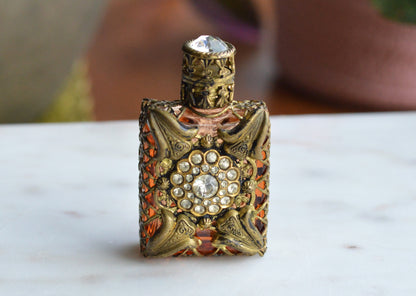 Vintage Jeweled Brass Filigree Perfume Bottle – Amber Glass, Clear Rhinestone Floral Medallion, Crystal Prism Stopper
