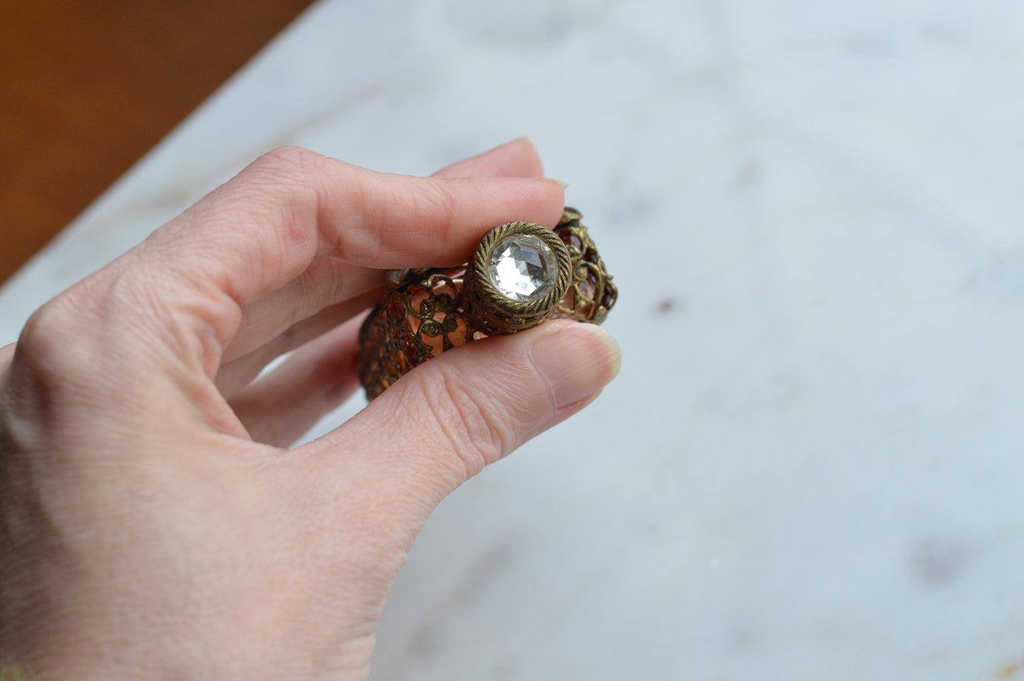 Vintage Jeweled Brass Filigree Perfume Bottle – Amber Glass, Clear Rhinestone Floral Medallion, Crystal Prism Stopper