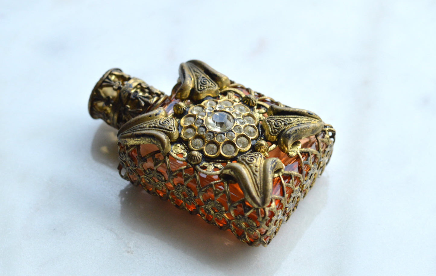 Vintage Jeweled Brass Filigree Perfume Bottle – Amber Glass, Clear Rhinestone Floral Medallion, Crystal Prism Stopper