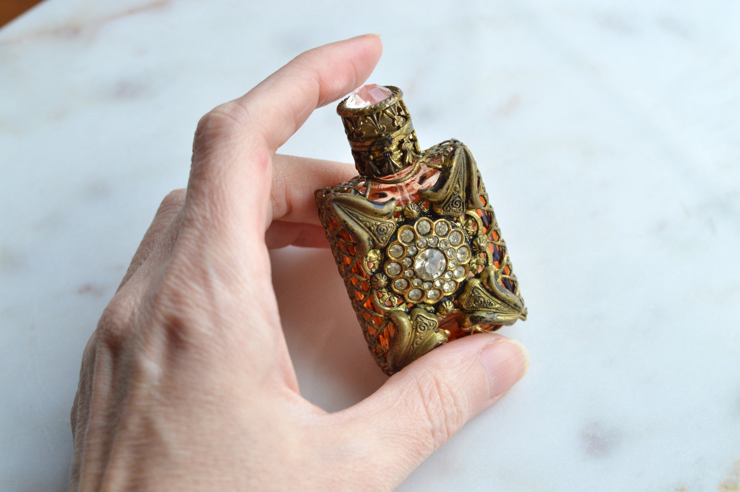 Vintage Jeweled Brass Filigree Perfume Bottle – Amber Glass, Clear Rhinestone Floral Medallion, Crystal Prism Stopper