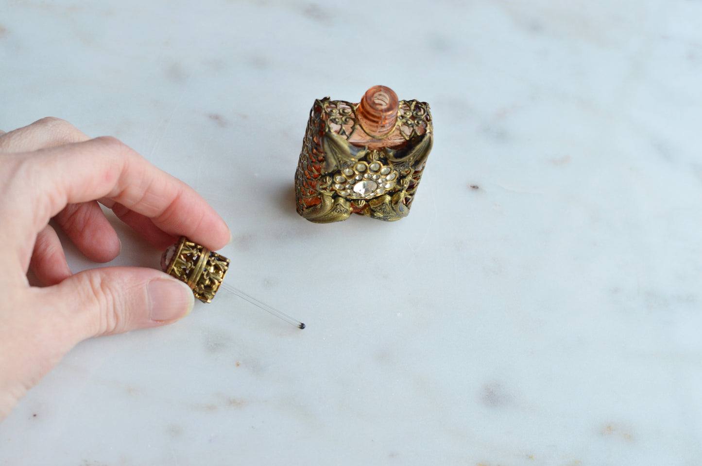 Vintage Jeweled Brass Filigree Perfume Bottle – Amber Glass, Clear Rhinestone Floral Medallion, Crystal Prism Stopper