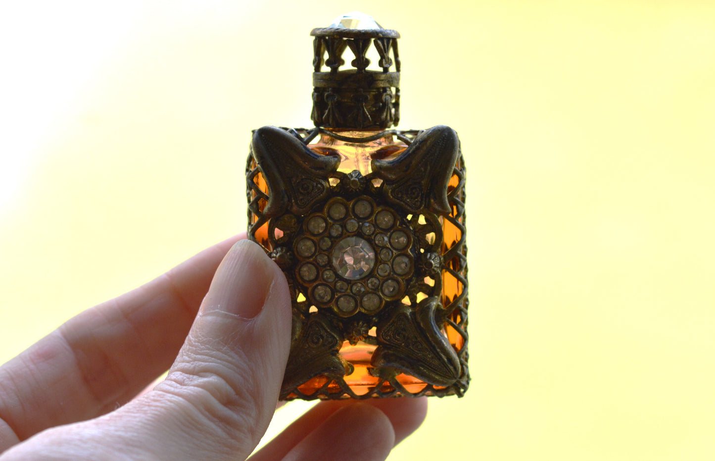 Vintage Jeweled Brass Filigree Perfume Bottle – Amber Glass, Clear Rhinestone Floral Medallion, Crystal Prism Stopper