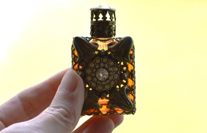 Vintage Jeweled Brass Filigree Perfume Bottle – Amber Glass, Clear Rhinestone Floral Medallion, Crystal Prism Stopper