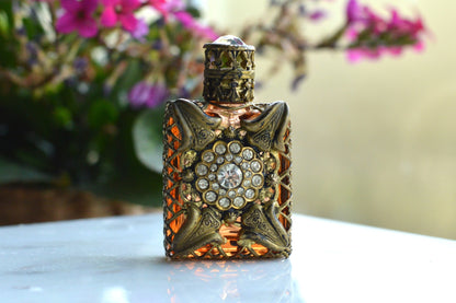 Vintage Jeweled Brass Filigree Perfume Bottle – Amber Glass, Clear Rhinestone Floral Medallion, Crystal Prism Stopper