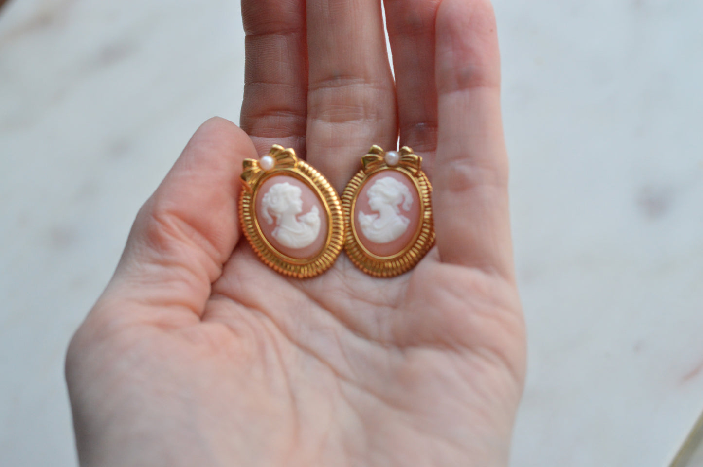 Vintage Avon Pink and White Cameo Earrings, Gold Tone Oval Studs with Bow and Faux Pearl Accents, Victorian Revival Style Estate Jewelry