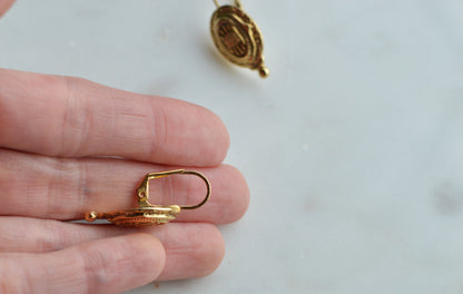 Vintage 1928 Jewelry Baroque Insignia Oval Drop Earrings - Gold Tone 17th Century Inspired Ornate Textured Dangle - Lever Back