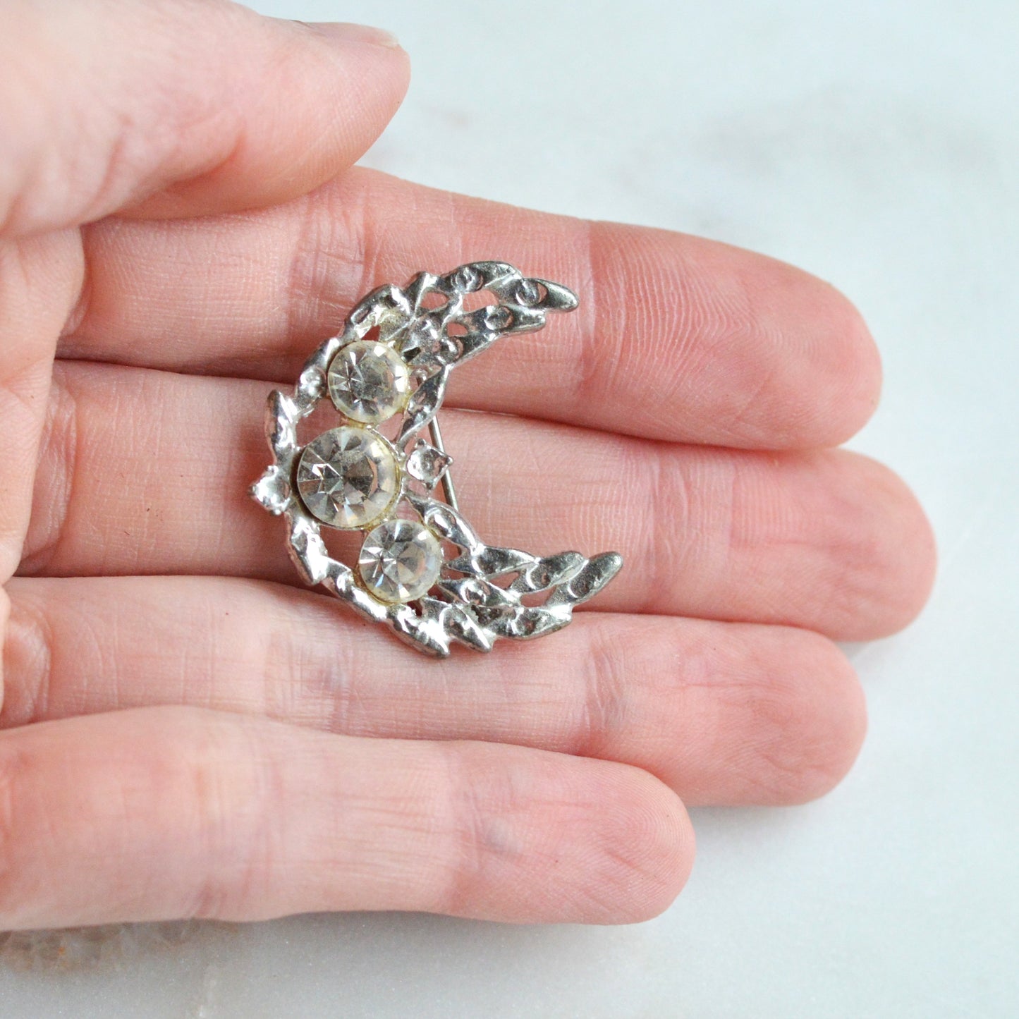 Vintage Silver Tone Crescent Moon Brooch | 1.15" Celestial Rhinestone Pin | Openwork Lunar Design | Mid-Century Modern Cosmic Accessory