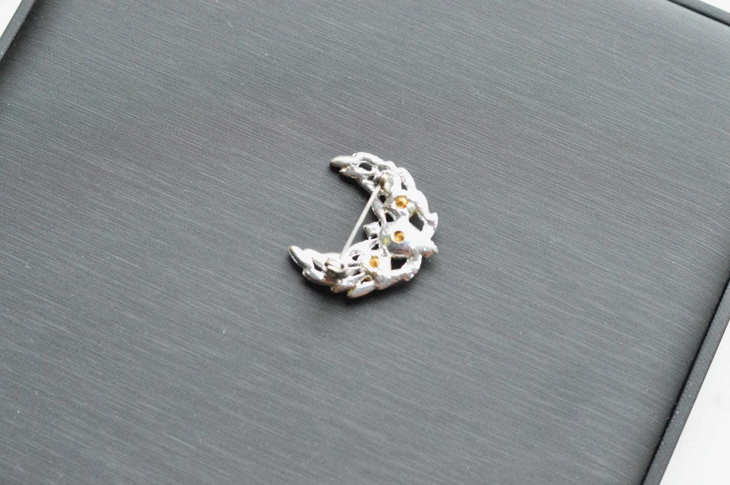 Vintage Silver Tone Crescent Moon Brooch | 1.15" Celestial Rhinestone Pin | Openwork Lunar Design | Mid-Century Modern Cosmic Accessory