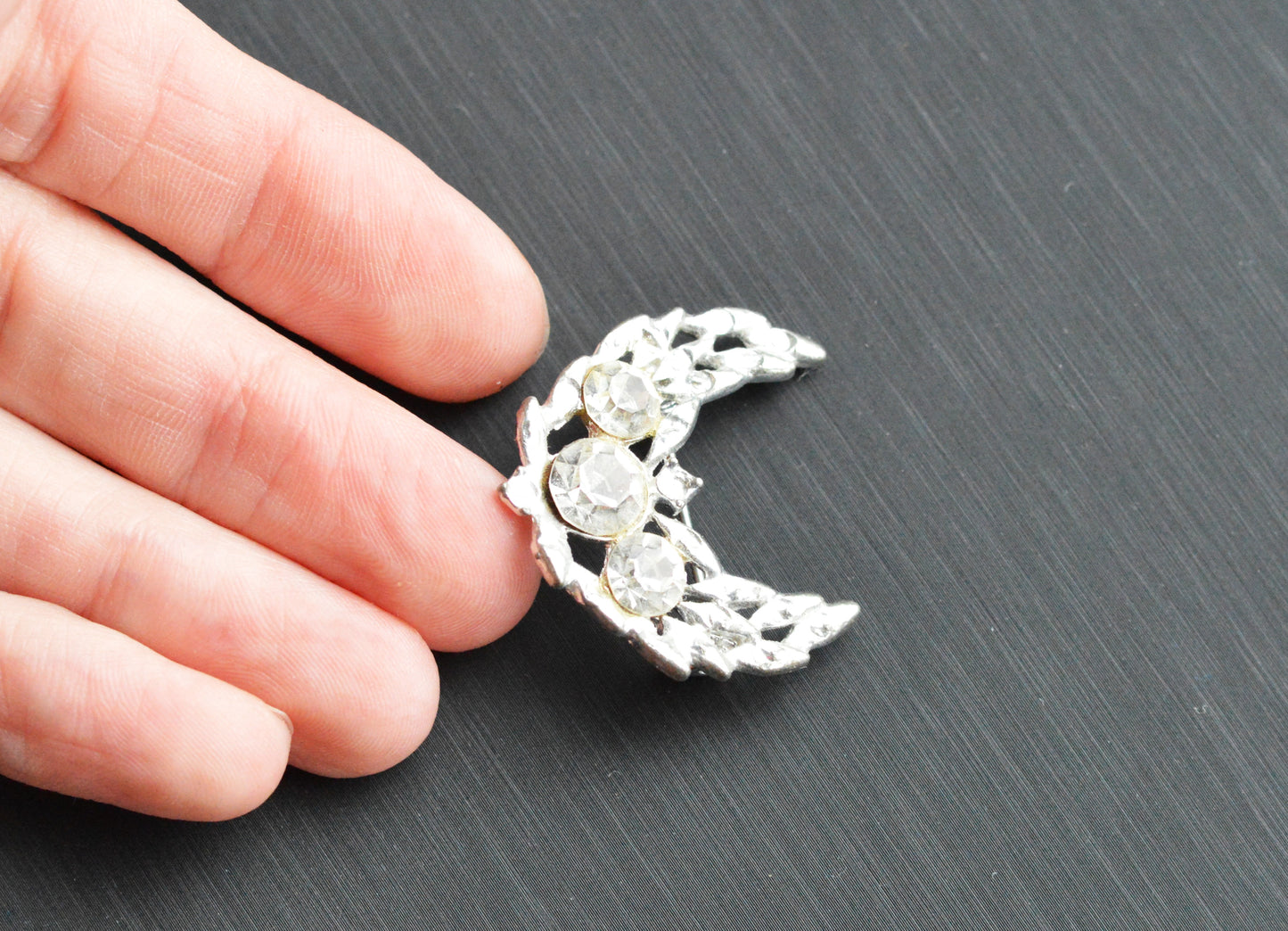 Vintage Silver Tone Crescent Moon Brooch | 1.15" Celestial Rhinestone Pin | Openwork Lunar Design | Mid-Century Modern Cosmic Accessory