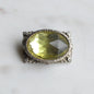 Vintage West Germany Style Brooch | 1.5" Faceted Peridot Green Glass | Ornate Silver Tone Filigree | Mid-Century Victorian Revival