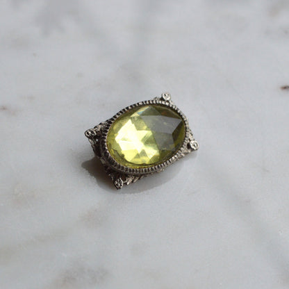 Vintage West Germany Style Brooch | 1.5" Faceted Peridot Green Glass | Ornate Silver Tone Filigree | Mid-Century Victorian Revival
