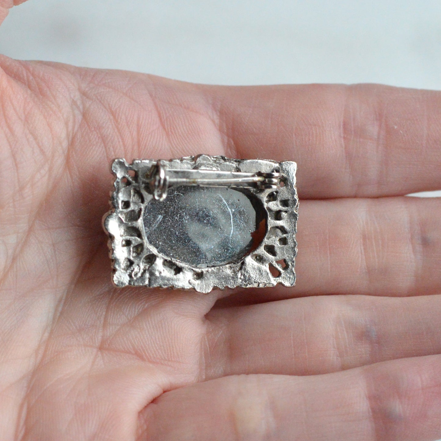 Vintage West Germany Style Brooch | 1.5" Faceted Peridot Green Glass | Ornate Silver Tone Filigree | Mid-Century Victorian Revival