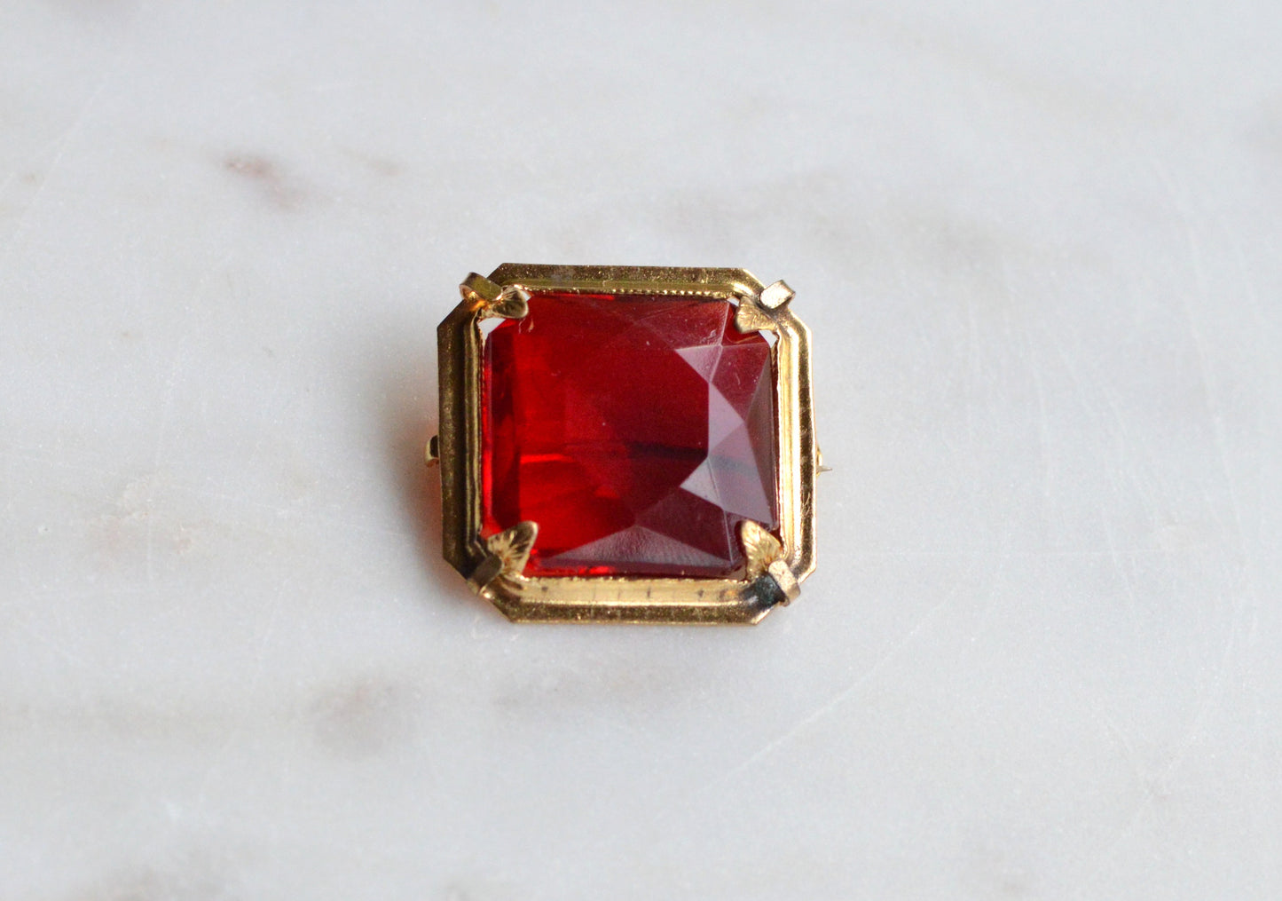 Antique Art Deco 1" Ruby Red Brooch | Large Emerald Cut Glass Stone | Ornate Open Back Gold Tone Statement Pin
