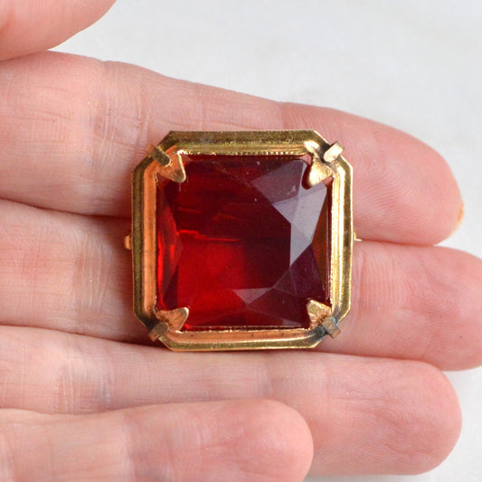 Antique Art Deco 1" Ruby Red Brooch | Large Emerald Cut Glass Stone | Ornate Open Back Gold Tone Statement Pin
