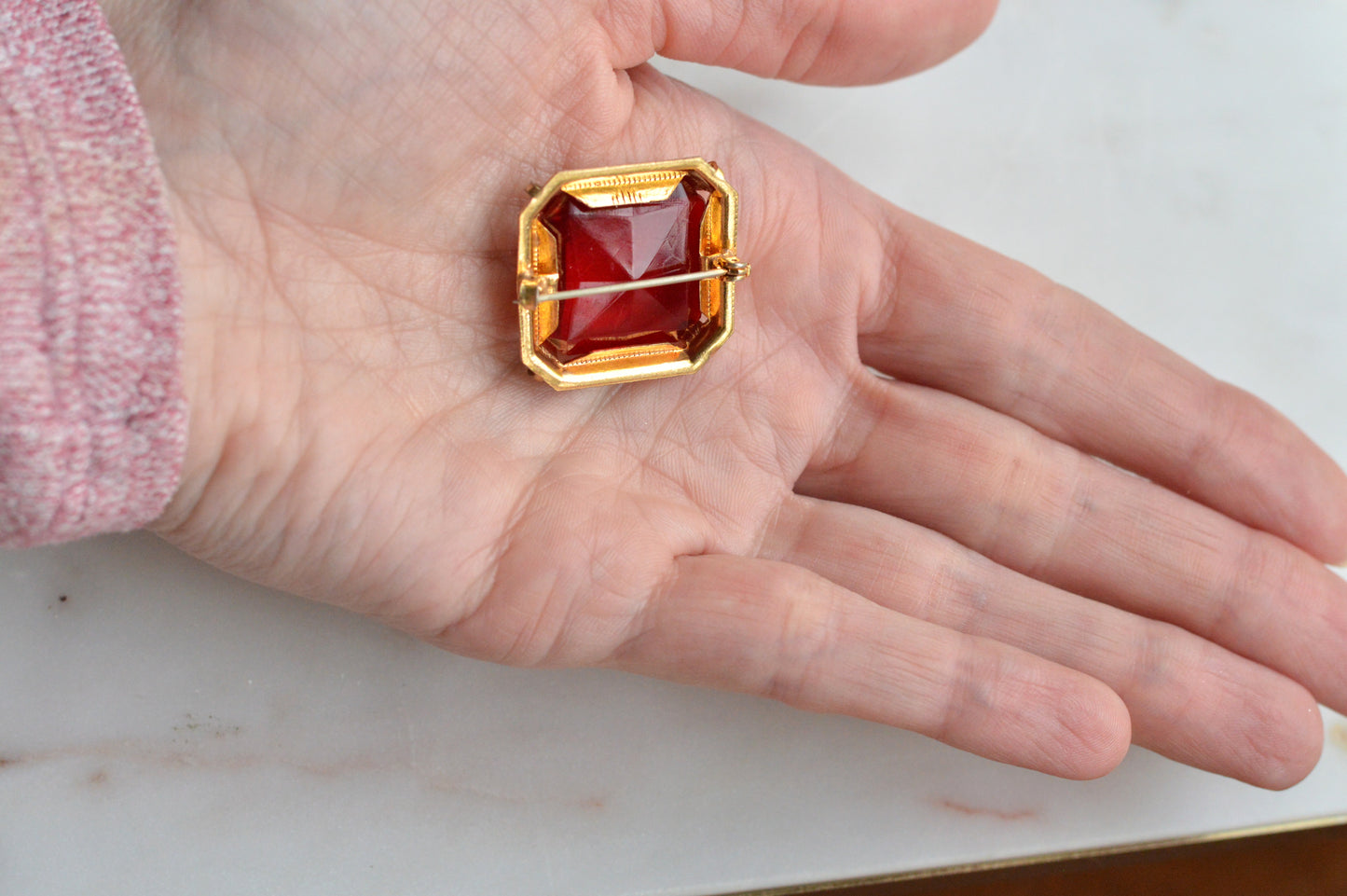 Antique Art Deco 1" Ruby Red Brooch | Large Emerald Cut Glass Stone | Ornate Open Back Gold Tone Statement Pin